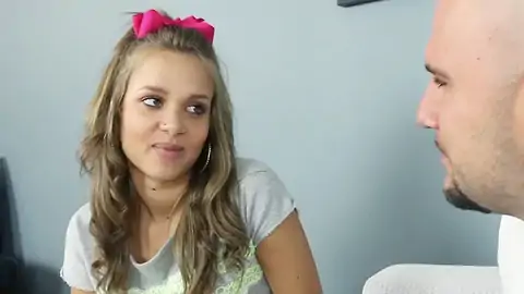 Light-haired teen with smallish bumpers chatting to a bald man