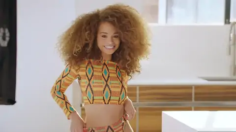 Teenage dark-hued with wavy hair is railing a fat jizz-shotgun on the sofa